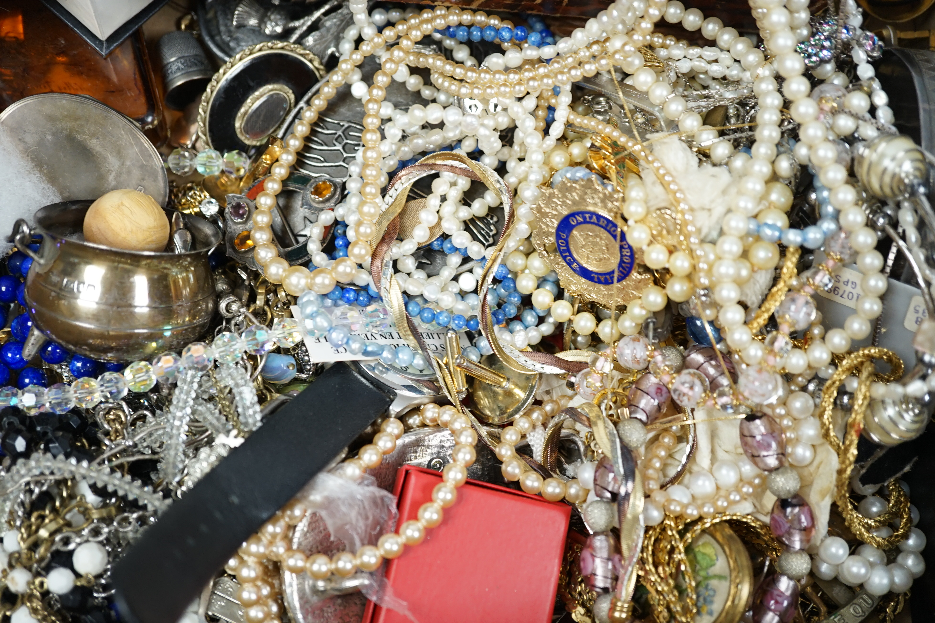 A quantity of assorted mainly costume jewellery and wrist watches, including a 19th century yellow metal and split coral set mourning brooch, a Scottish hardstone set white metal brooch and a Victorian silver oval locket